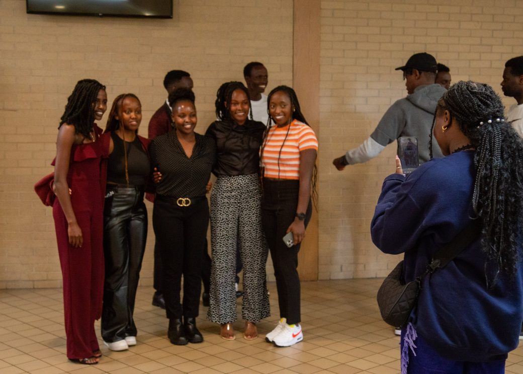 People smiling to the camera at Commencement 2024: Nurses' Pinning Ceremony