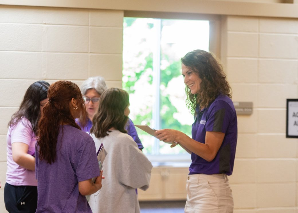Gosehn college teacher talking to a student