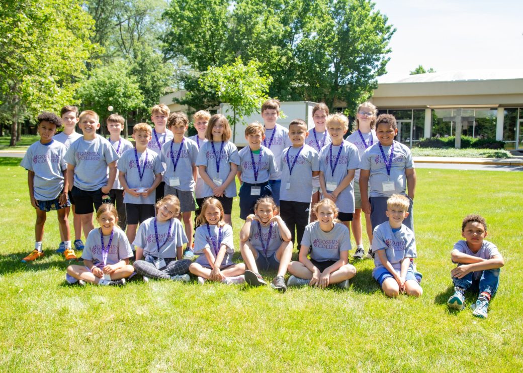 Young kids smiling to the camera at Summer Camps 2024
