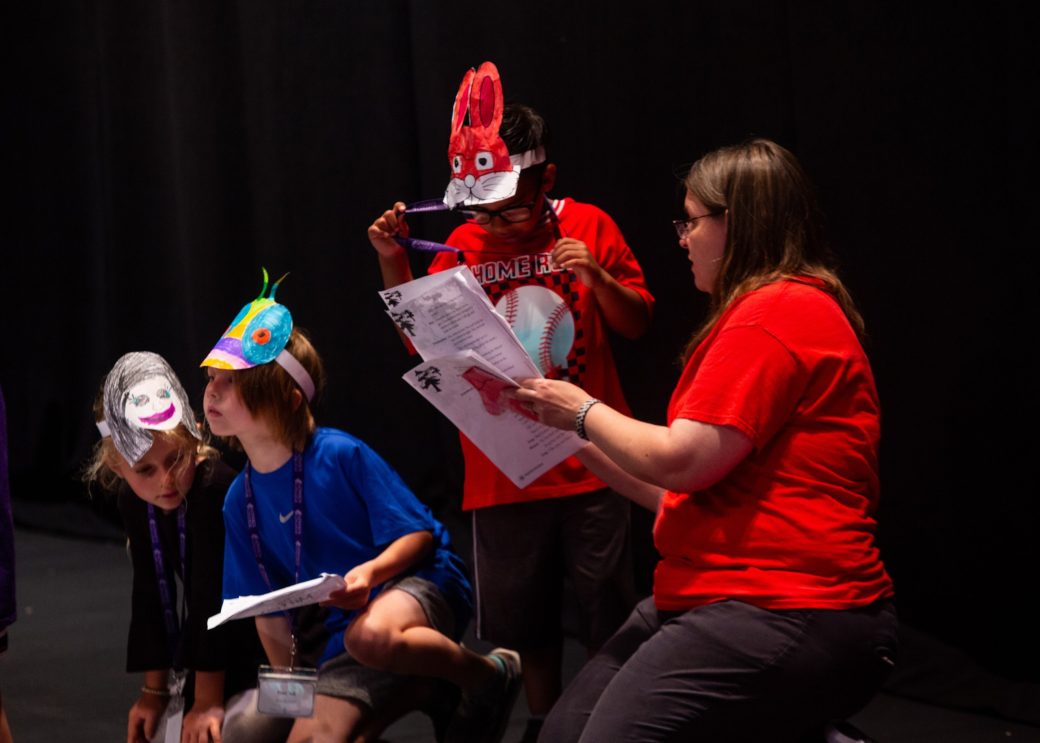 People with character masks at Goshen college