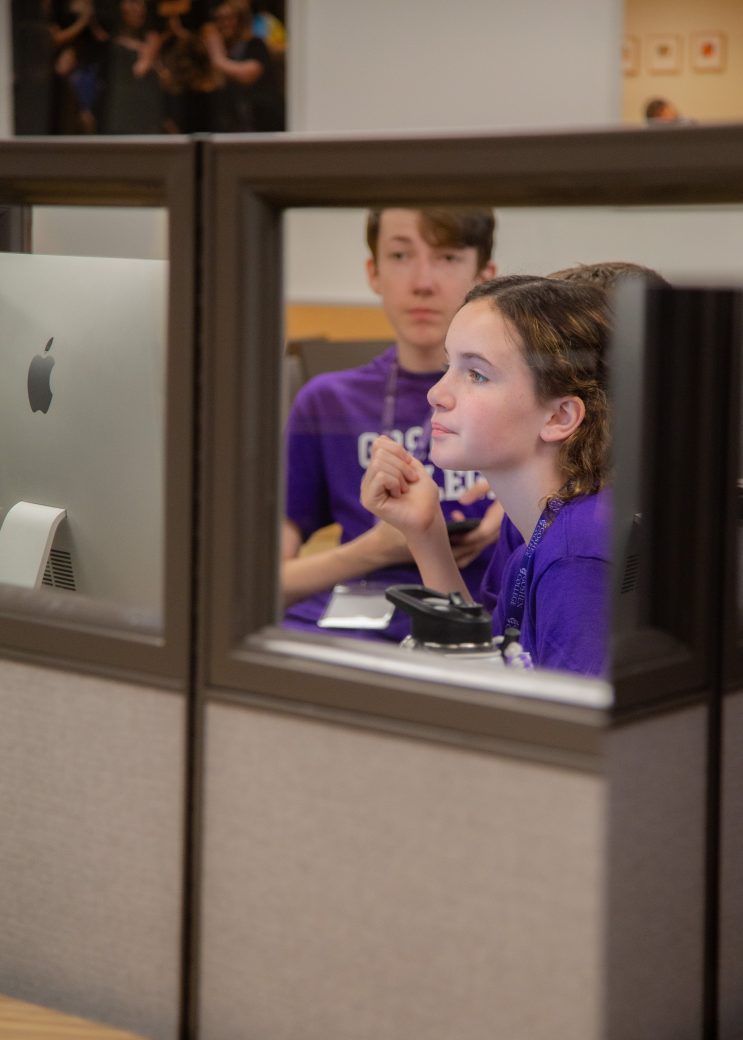 Teens looking at the computers
