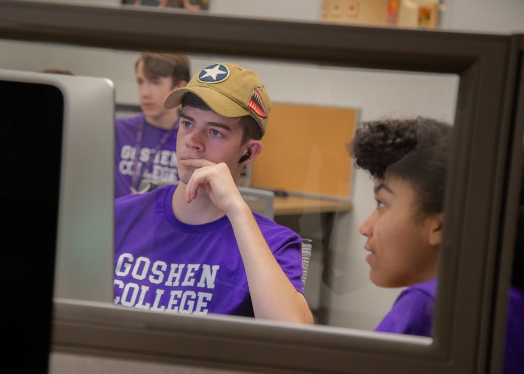 Teens looking at the computers