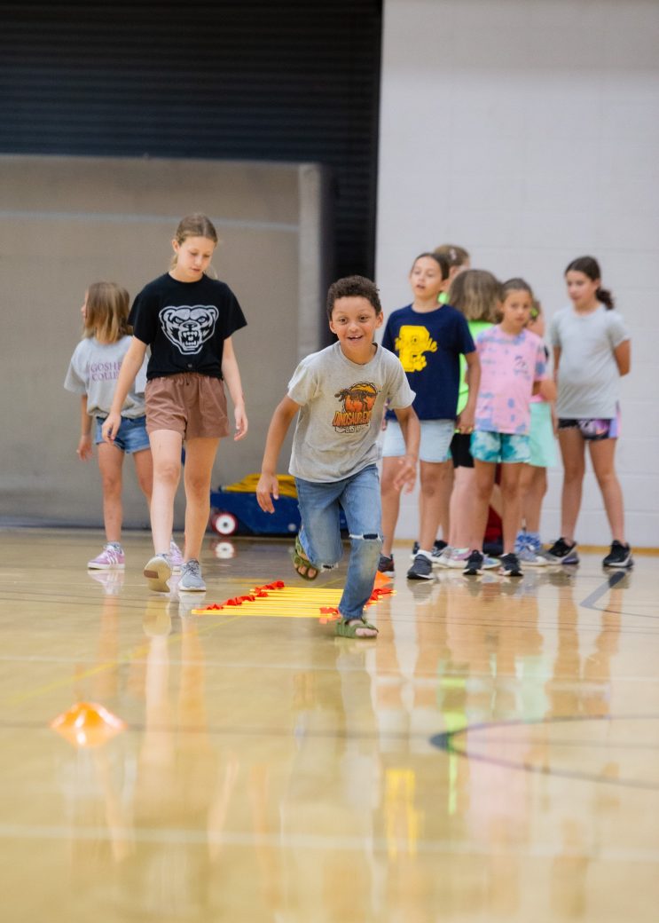 Kids playing in a gym at Summer Camps 2024