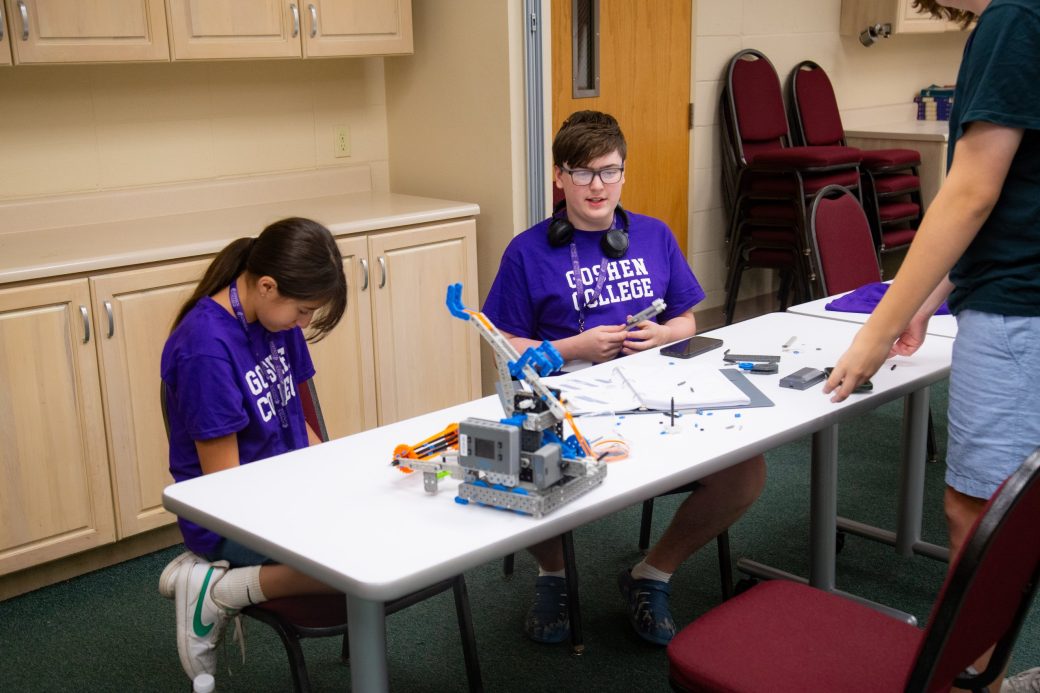 Teens looking in the microscope