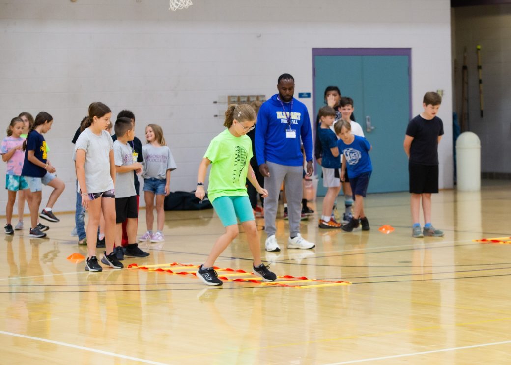 Kid playing in a gym at Summer Camps 2024