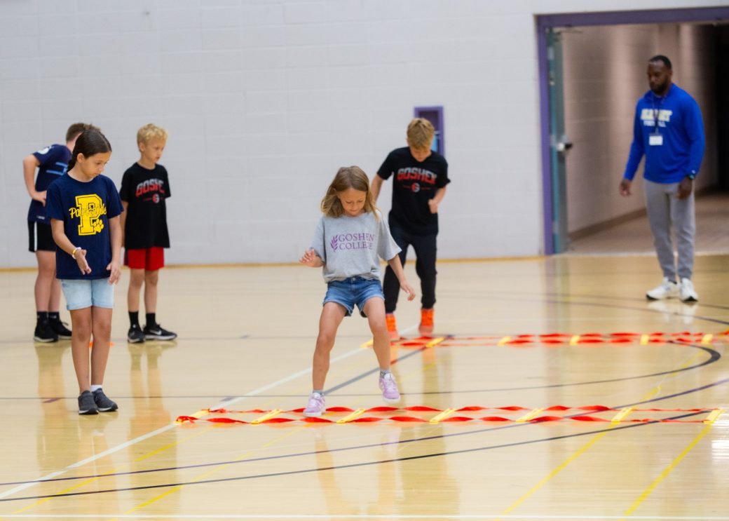 Kid playing in a gym at Summer Camps 2024