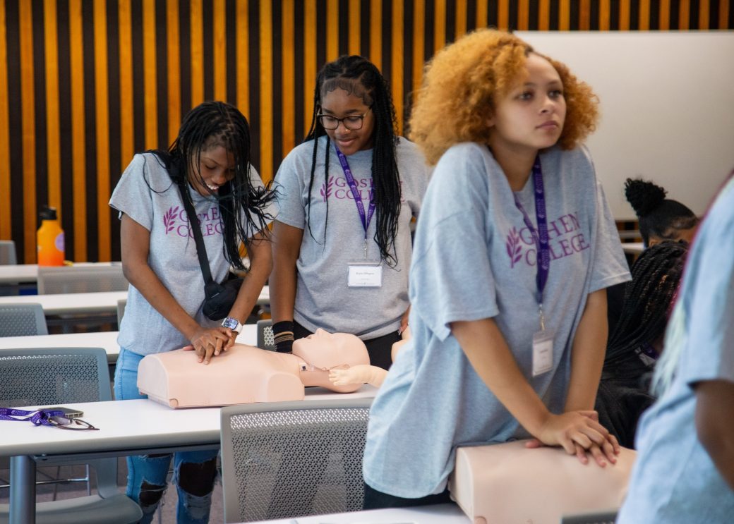 Goshen college employees making toy babies