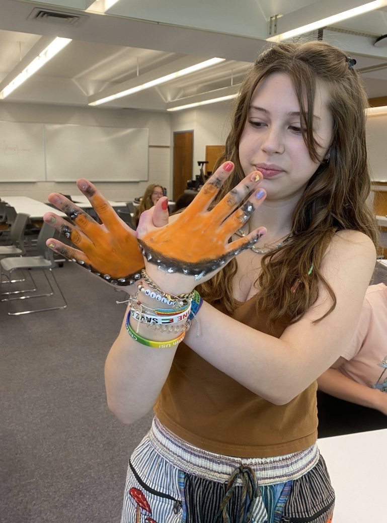 Teen showing an art in her hand