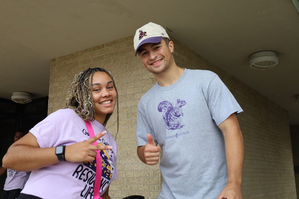 Goshen college students smiling to the camera at start of classes
