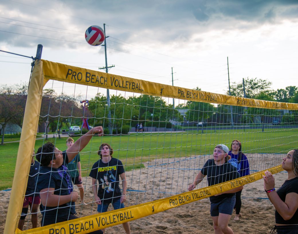 Goshen college students playing volleybal