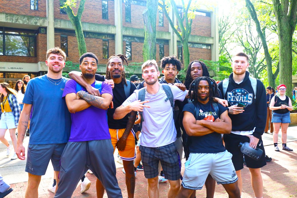 Goshen college students smiling to the camera at start of classes