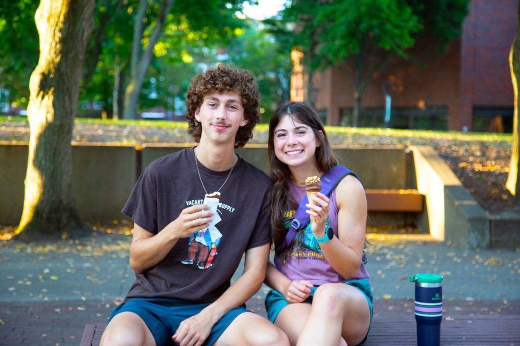 Goshen college students smiling to the camera