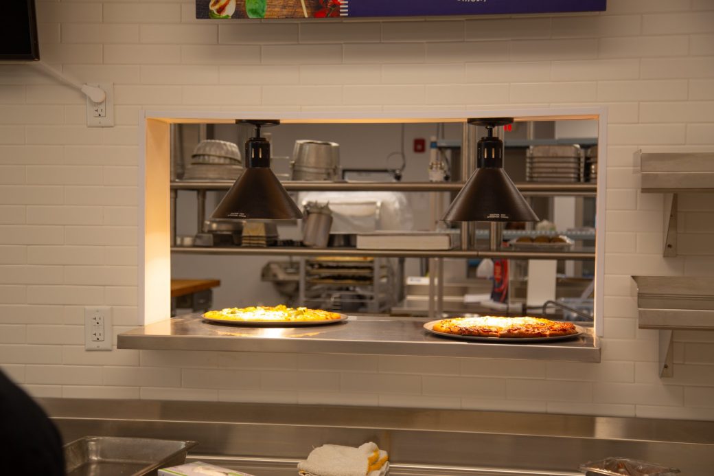Two pizza roasted in a table Westlawn Dining Hall