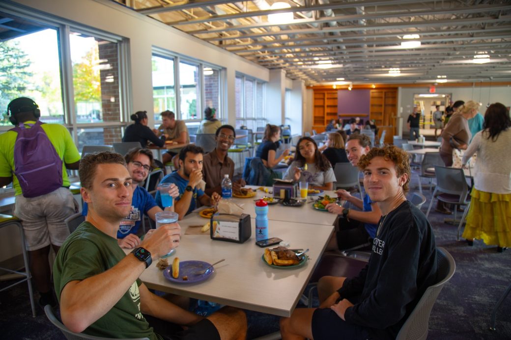 Goshen college students striciking a pose at Westlawn Dining Hall
