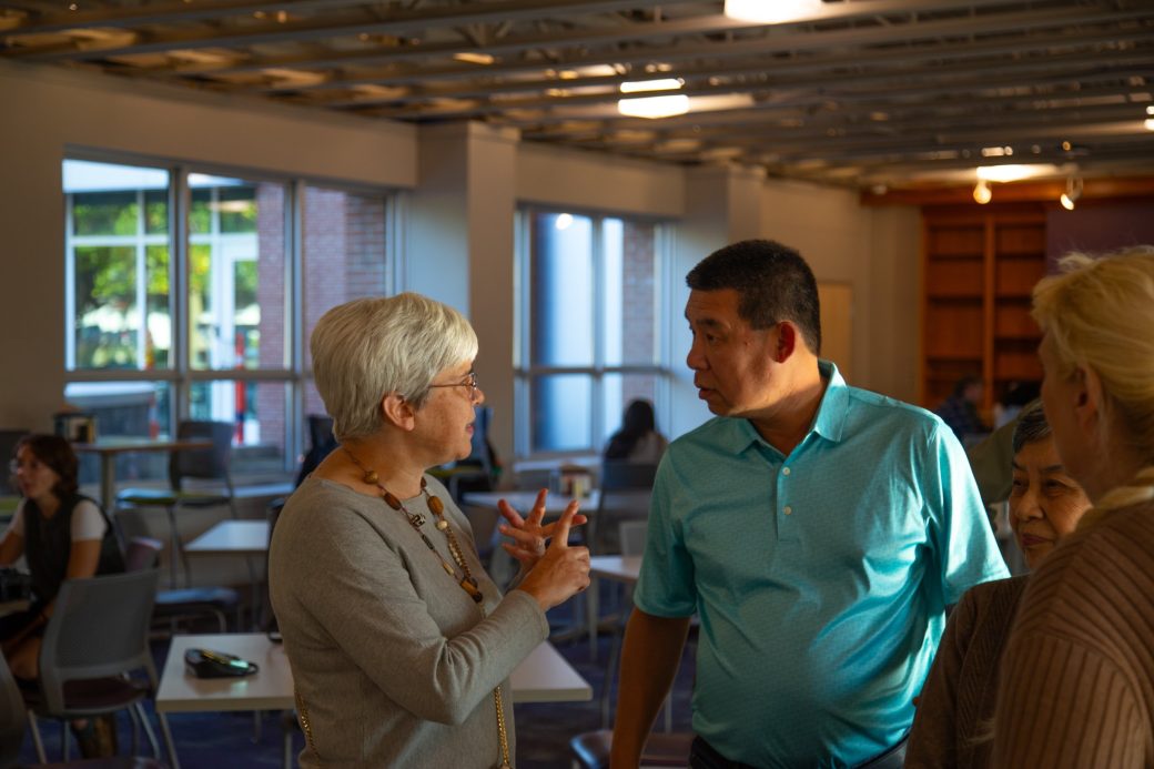 A man and woman talking at Westlawn Dining Hall