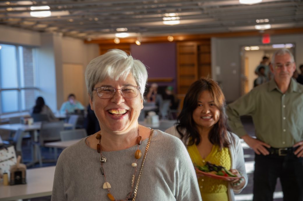 Woman smiling to the camera at Westlawn Dining Hall