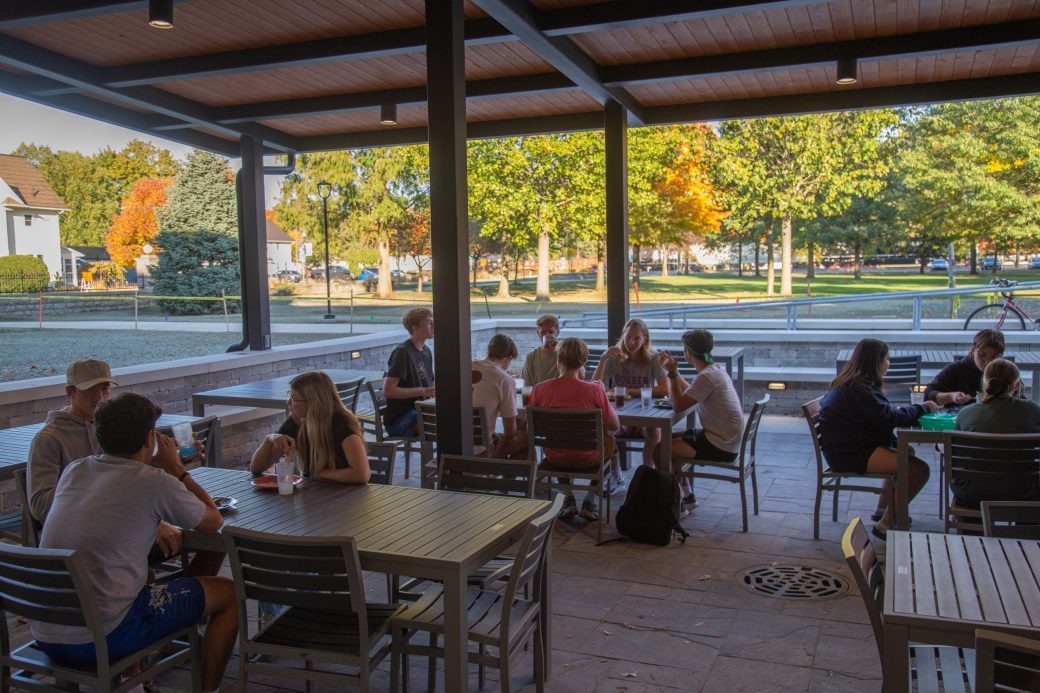 Goshen colege students eating and talking at Westlawn Dining Hall