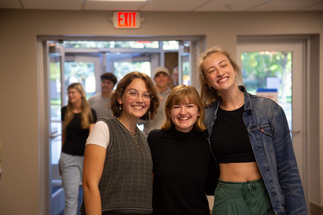 People hugging at Westlawn Dining Hall reopens