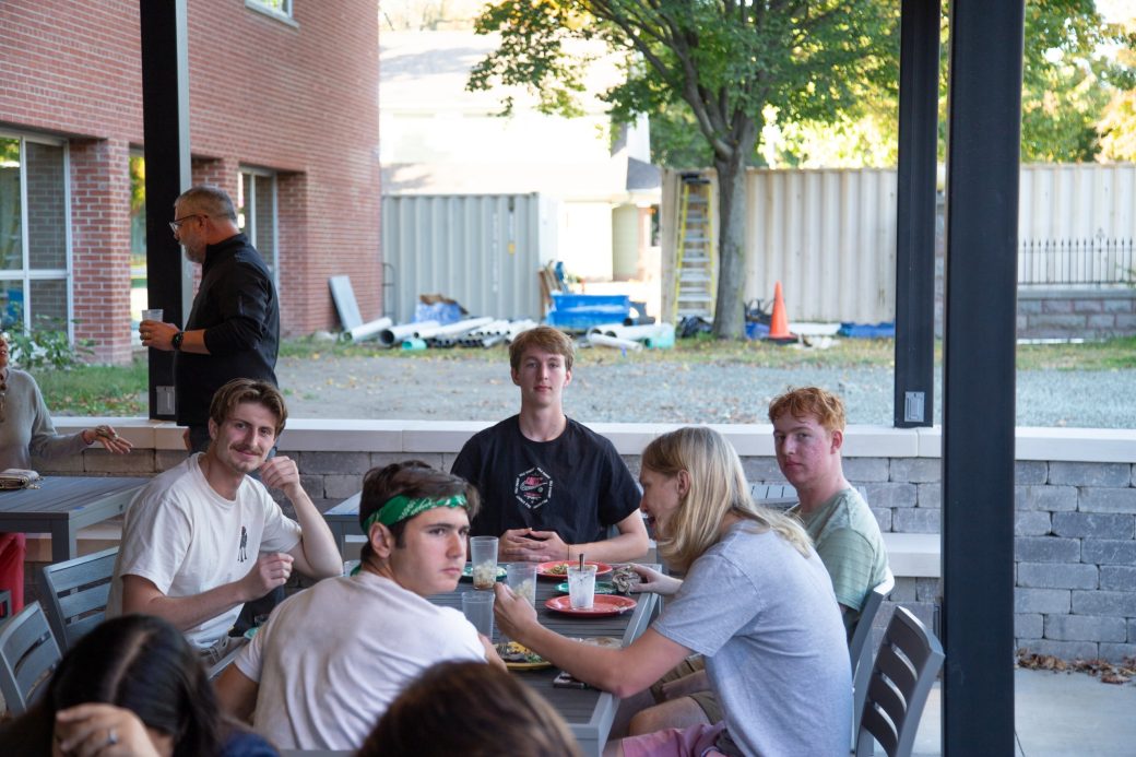 Gosehn college students eating and smiling to the camera