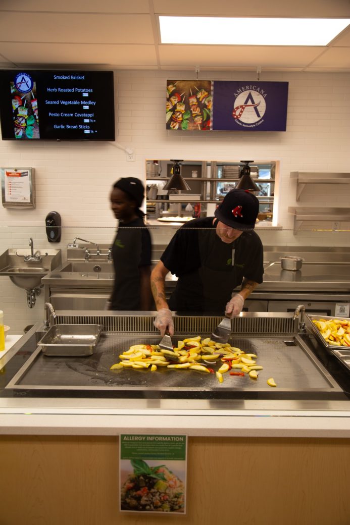 Goshen college employee doing french fries