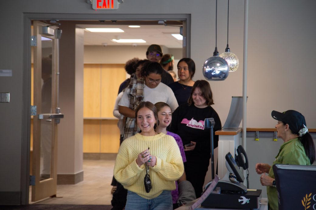 Goshen college students in a line at Westlawn Dining Hall