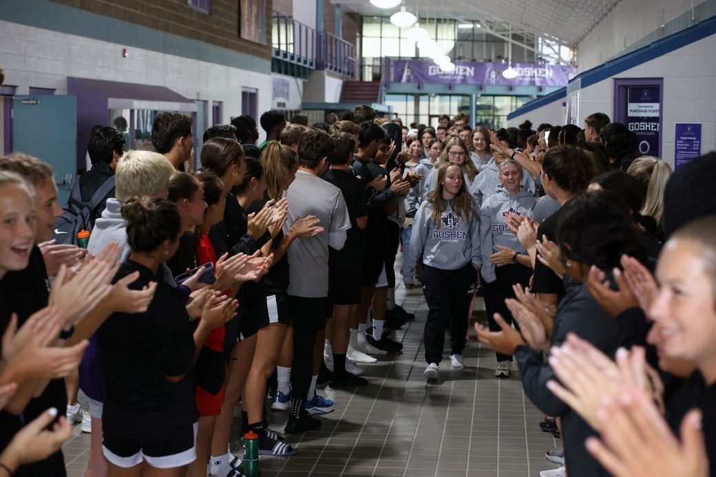 GC students clapping to the GC athlete