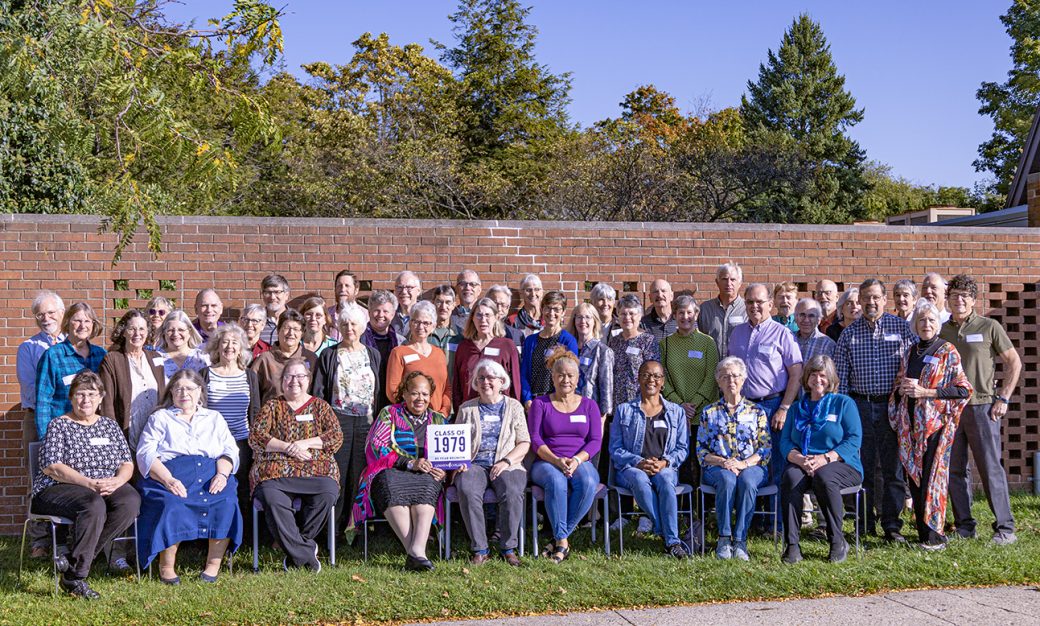 People smiling to the camera at Class Reunions 2024