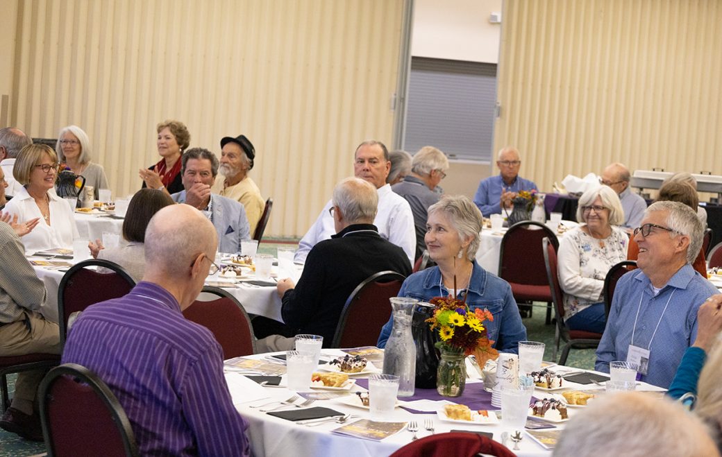 People talking and having a dinner at Class Reunion 2024