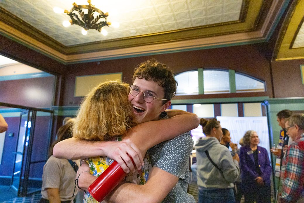 A men and a woman hugging at Connectapalooza