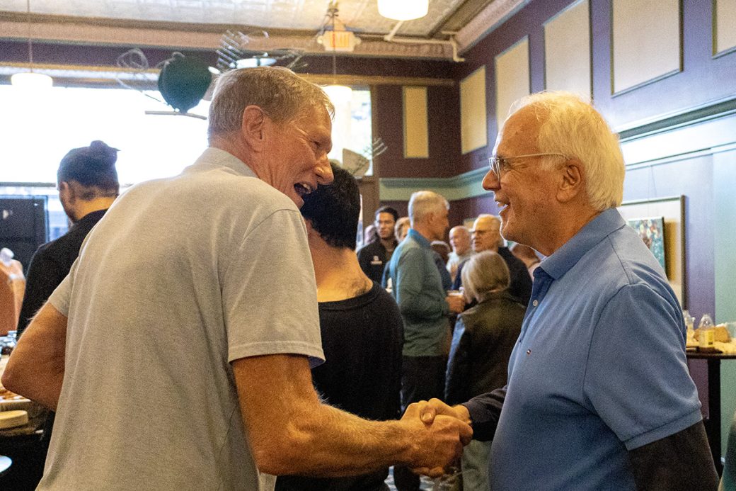 Two men talking at Connectapalooza