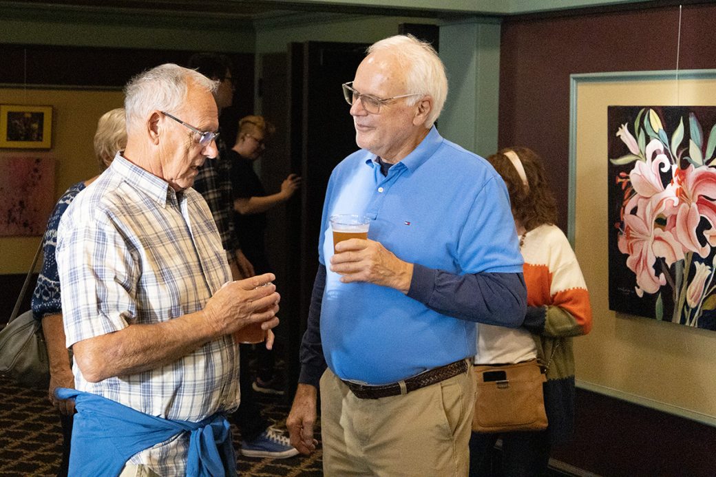 Two men talking at Connectapalooza