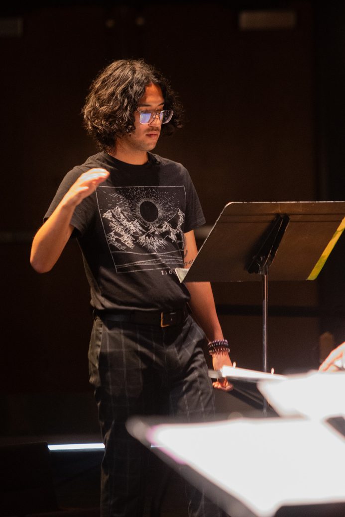 choir conductor conducting the music choir