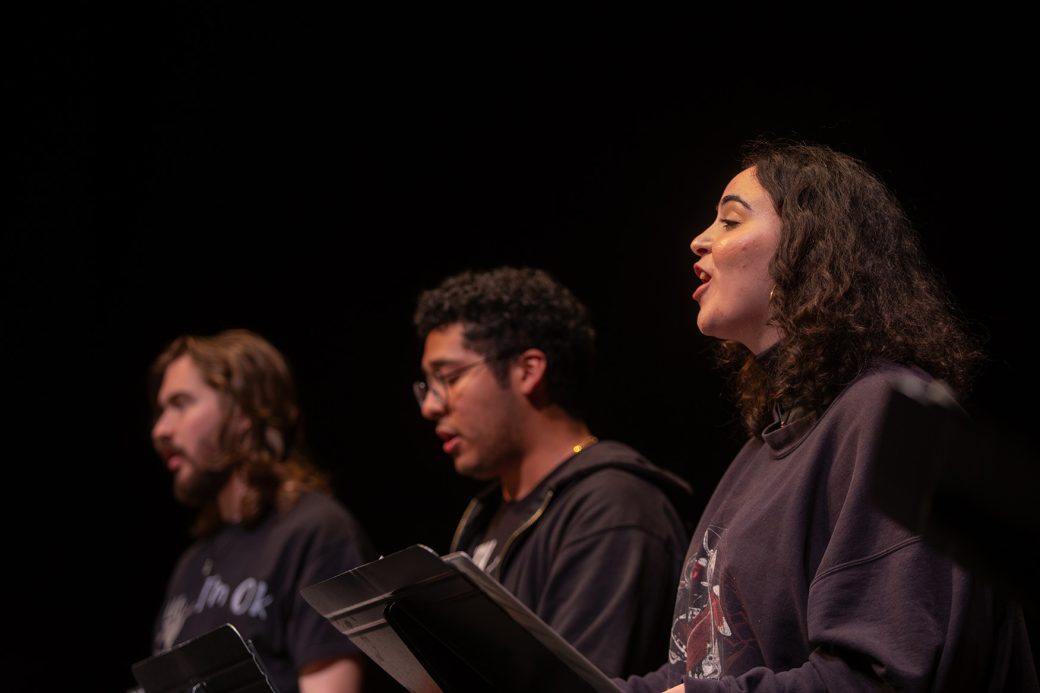 Music choir members doing a performance at Homecoming weekend 2024