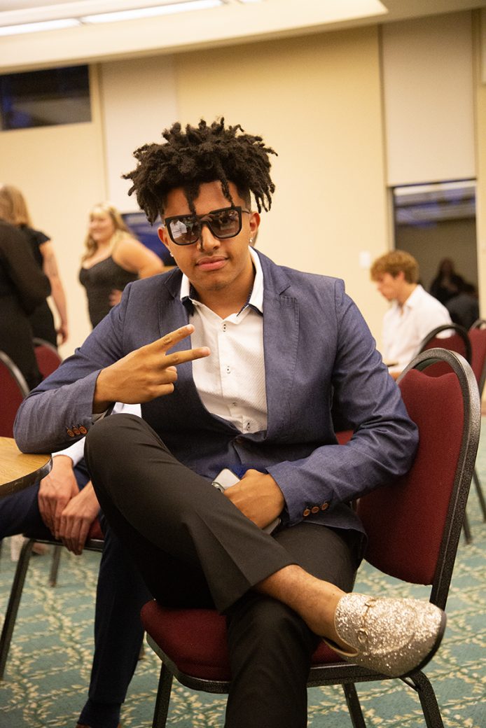 man stricking a pose at LEAFYs athletic award ceremony