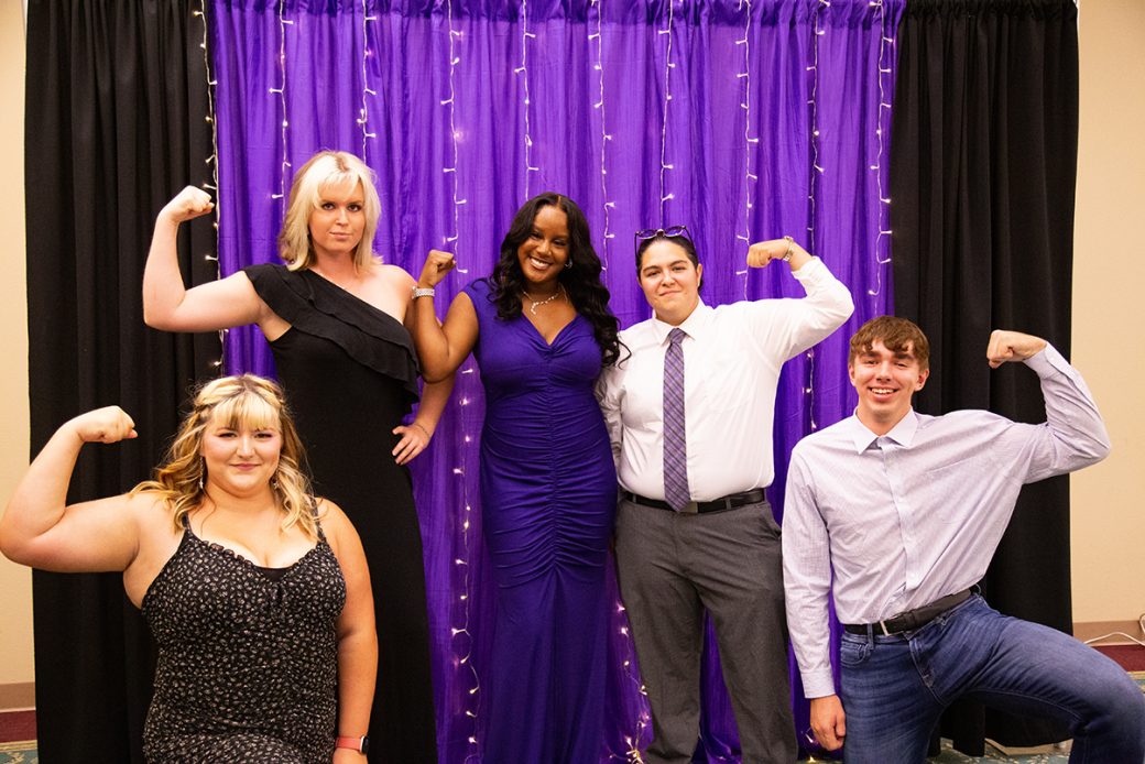 People stricking a pose at LEAFYs athletic award ceremony