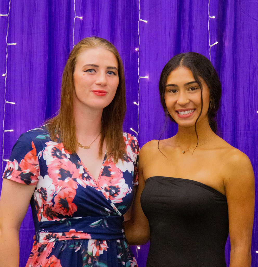 Two women smiling to the camera at LEAFYs athletic award ceremony