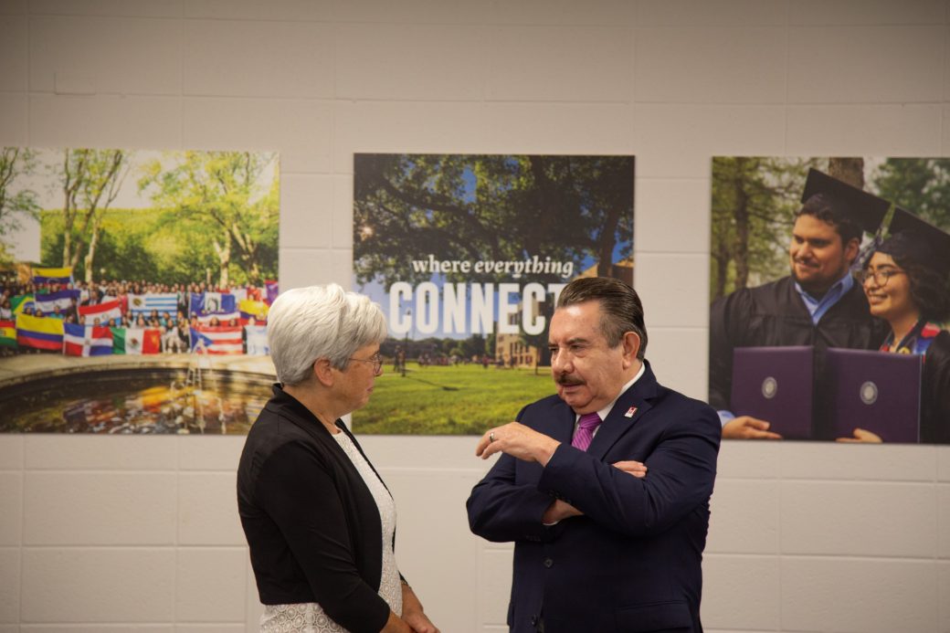 Man and a woman talking at Goshen college