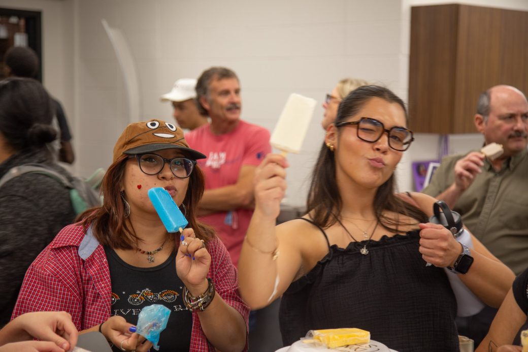 Goshen college students tasting popsicle