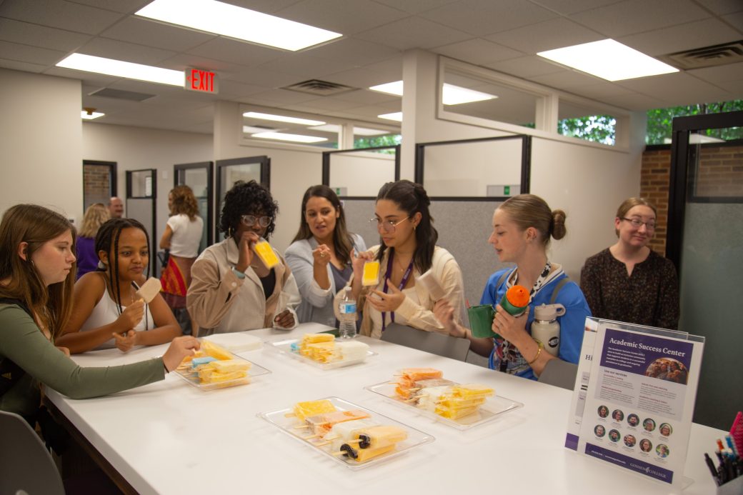 Goshen college students tasting popsicle