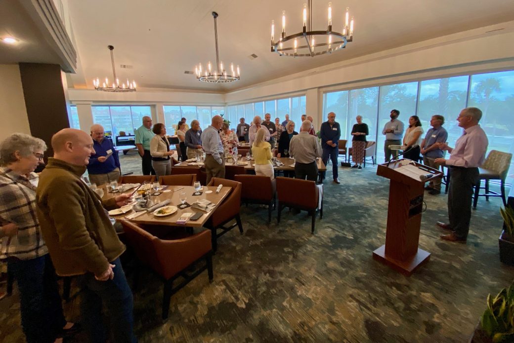 Man speaking in a pulpit at Connected Cause Alumni & Friends Gathering: Sarasota, Florida
