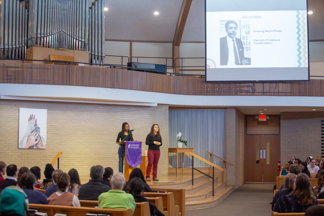 Goshen college student giving a speech in the chapel
