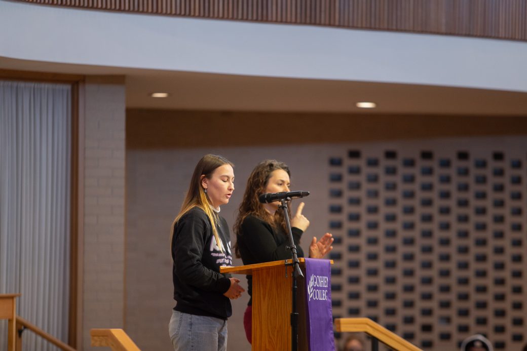 Goshen college student giving a speech in the chapel