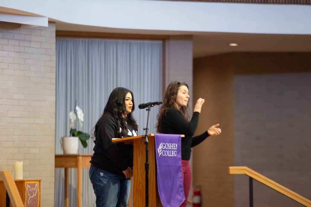Goshen college student giving a speech in the chapel