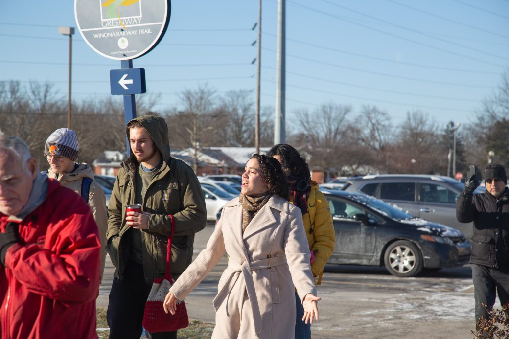 A man and a woman marching at 2025 MLK celebration