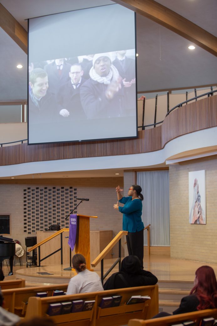 Sign language speaker making gestures in sign language at Martin Luther King, Jr. 2025 Celebration