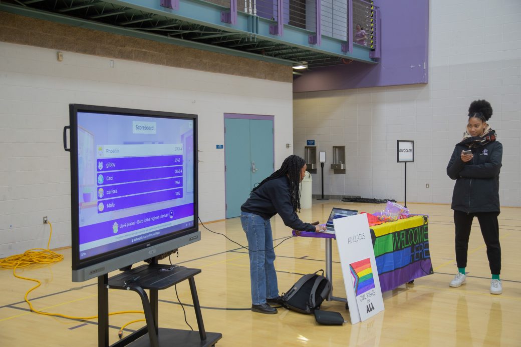 Woman in a table emphasizing respect for LGBTQIA+ people.