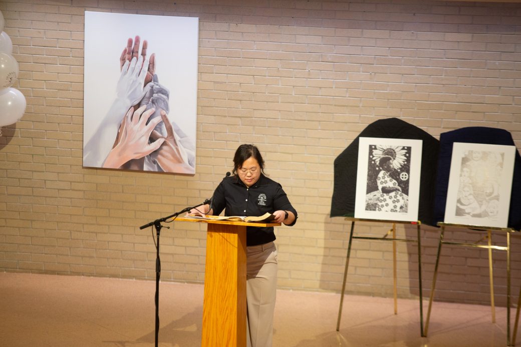 Woman doing a speech at stage's pulpit