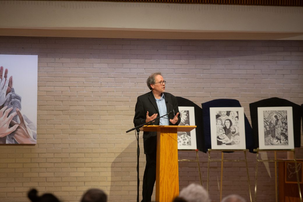 man doing a speech at stage's pulpit
