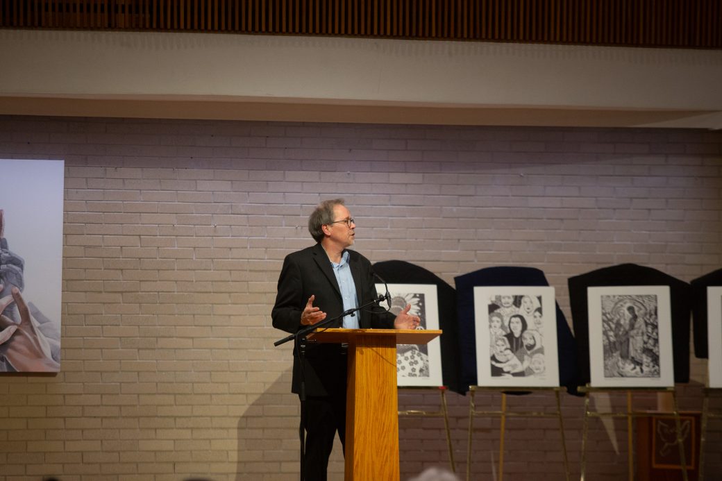 man doing a speech at stage's pulpit