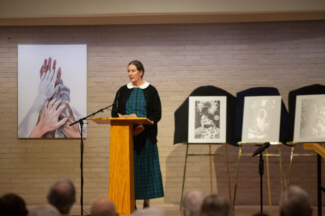 Woman doing a speech at stage's pulpit